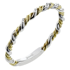 Two tones of 18k gold twist around each other in this contemporary yet timeless engagement ring.