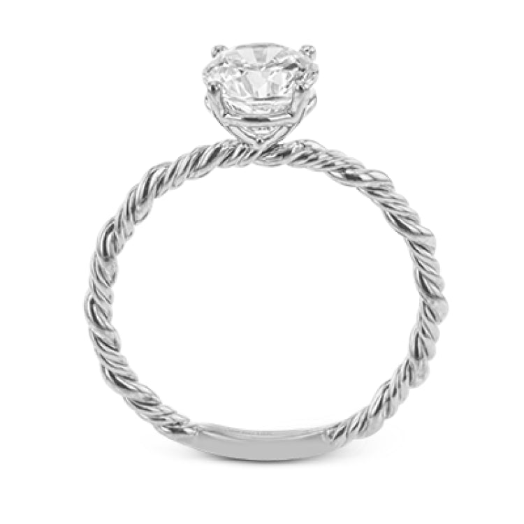 Two tones of 18k gold twist around each other in this contemporary yet timeless engagement ring.