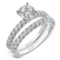 This engagement ring is sure to shine, with a classic straight design set with .49 ctw of white side diamonds.