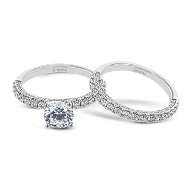This engagement ring is sure to shine, with a classic straight design set with .49 ctw of white side diamonds.