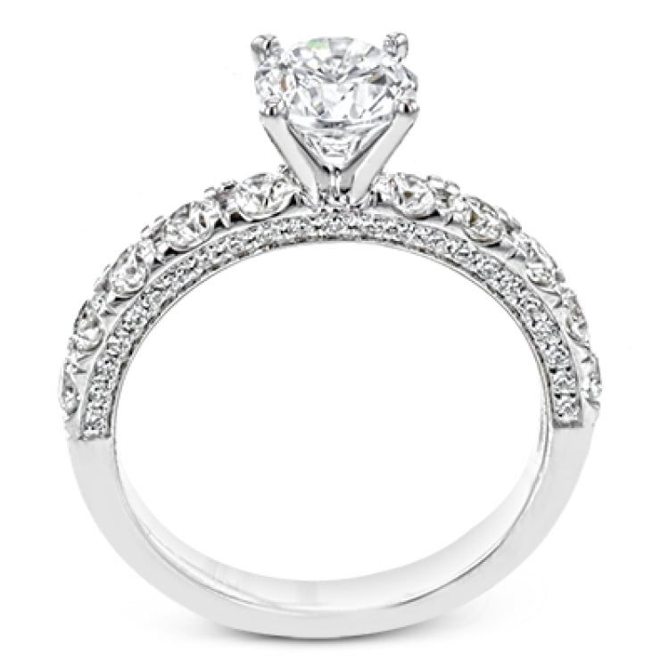 This engagement ring is stunning from every side, with .97 ctw of white round diamonds on the top and sides of the ring.