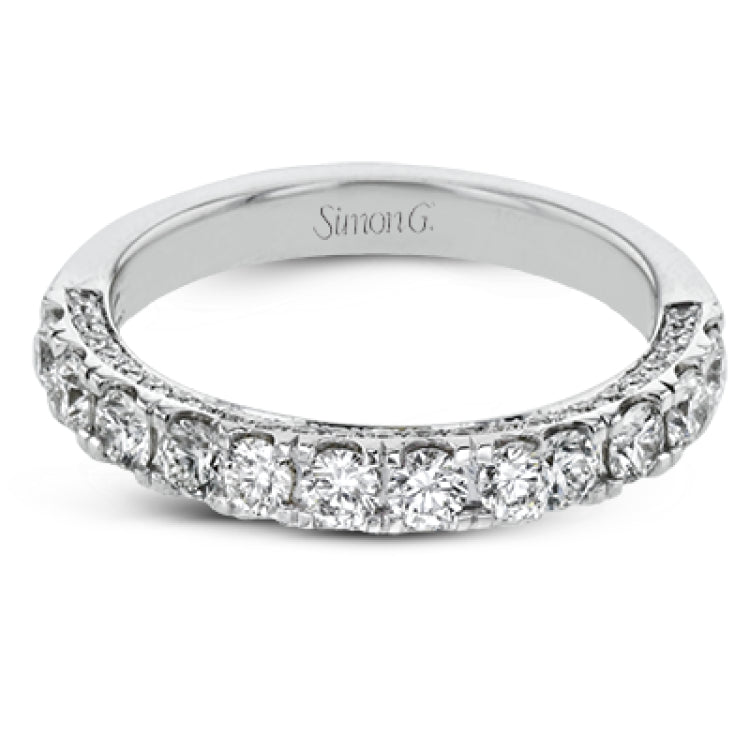 This engagement ring is stunning from every side, with .97 ctw of white round diamonds on the top and sides of the ring.