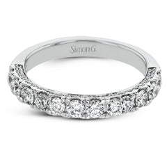 This engagement ring is stunning from every side, with .97 ctw of white round diamonds on the top and sides of the ring.