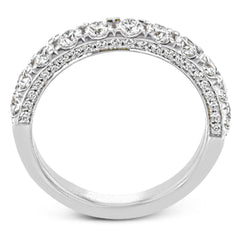 This engagement ring is stunning from every side, with .97 ctw of white round diamonds on the top and sides of the ring.