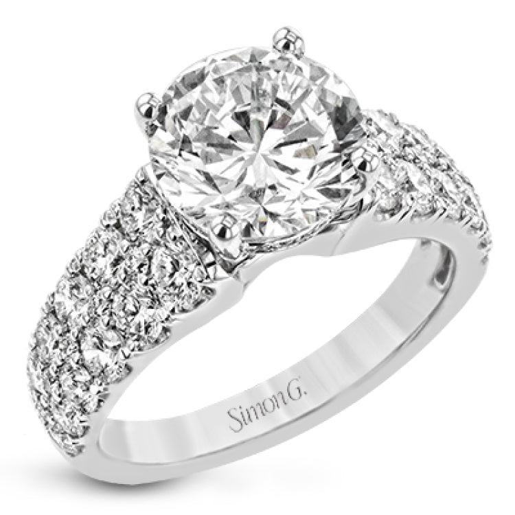 This bold engagement ring contains 1.50 ctw of side diamonds and will be sure to draw anyone's eyes with its modern design.