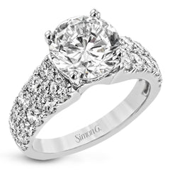 This bold engagement ring contains 1.50 ctw of side diamonds and will be sure to draw anyone's eyes with its modern design.