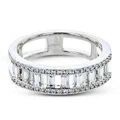 Baguette diamonds stand to attention and create and architectural effect in this unique 18k white gold ring design.