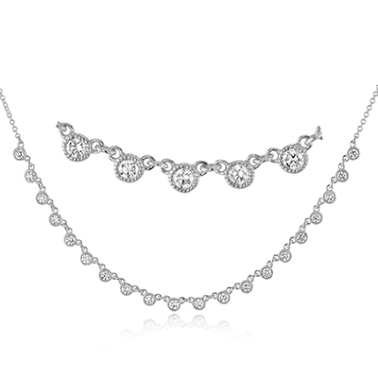 A line of .61 ctw bezel set diamonds lay gracefully across the clavicle in this 18k yellow gold necklace that is perfect for layering.