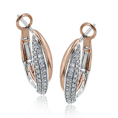These bold earrings create a statement by combining 18k yellow and white gold, accented by .46 ctw of white diamonds.
