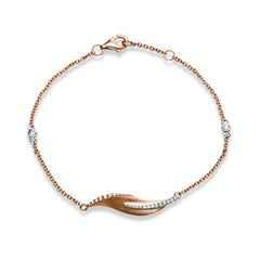 This nature-inspired 18k rose gold bracelet contains .20 ctw of diamonds in a leaf design.