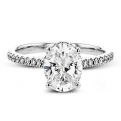 This 18k white gold engagement ring is perfect for an oval center stone, accented by .32 ctw of white diamonds.