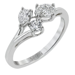 Our modern update on the three stone ring, this piece features a round, pear, and oval diamond brought together in a stunning design.