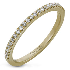 Simple yet stunning, this graceful engagement ring is made for a round cut center stone and is set with .16 ctw of white diamonds.