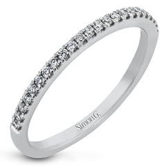 Simple yet stunning, this graceful engagement ring is made for a round cut center stone and is set with .16 ctw of white diamonds.