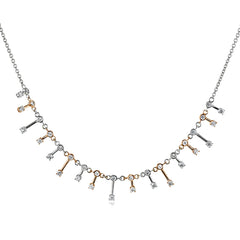 This delicate two-tone necklace of 18K white and rose gold, sparkles in an icicle motif with 0.65 ctw of diamonds.