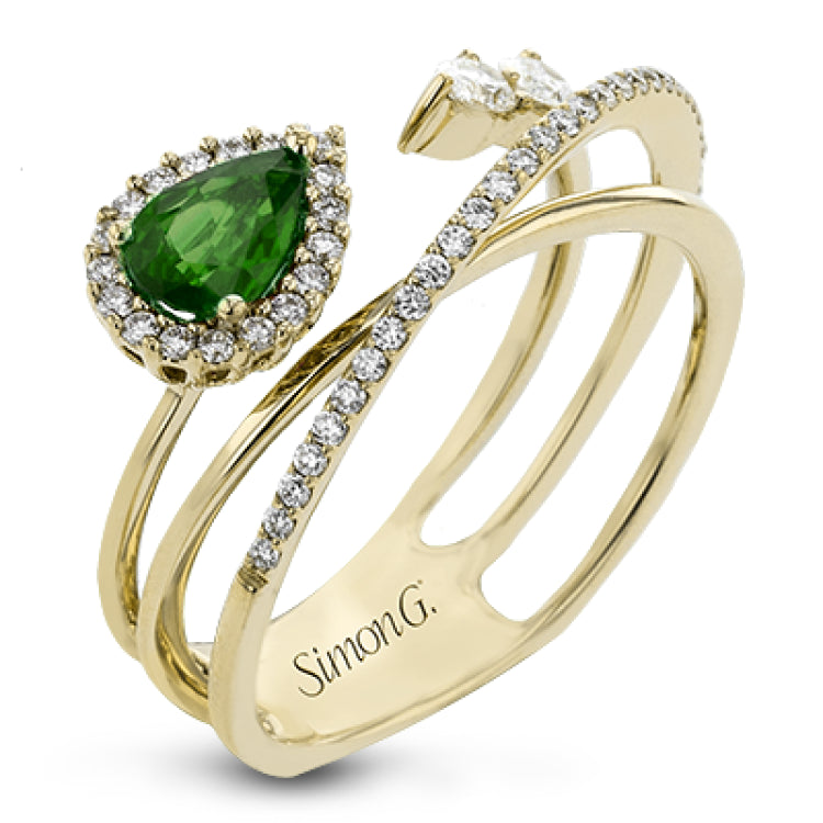 This 18k yellow gold ring is set with a lovely .42 ctw green pear shaped emerald and .34 ctw of white diamonds.