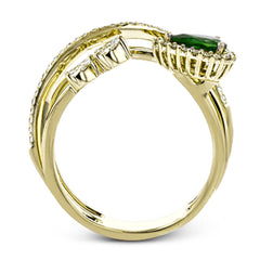 This 18k yellow gold ring is set with a lovely .42 ctw green pear shaped emerald and .34 ctw of white diamonds.