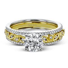 This beautiful two-tone 18k gold wedding set features an organic design white gold inner ring, with a yellow gold jacket surrounding it that is set with .22 ctw of yellow diamonds.