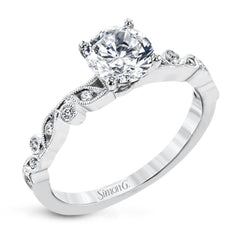 This beautiful two-tone 18k gold wedding set features an organic design white gold inner ring, with a yellow gold jacket surrounding it that is set with .22 ctw of yellow diamonds.
