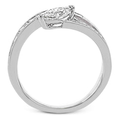 Baguette diamonds and milgrain details in white gold enhance the marquise center stone set at an angle in this dynamic Lightning Collection ring.