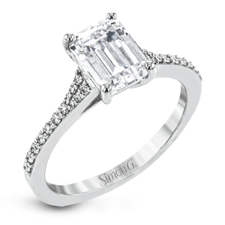 Simple yet stunning, this graceful engagement ring is made for an emerald cut center stone and is set with .16 ctw of white diamonds.