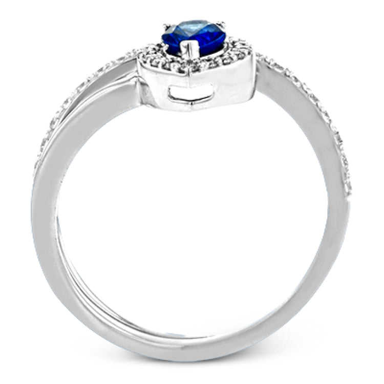 This spiraling 18k white gold ring features a .54 ct pear shaped blue sapphire accented by .33 ctw of white diamonds.