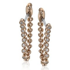 These versatile earrings can be worn in two ways, transforming from a line of diamonds into soft hoops. They're perfect for going from day to night.