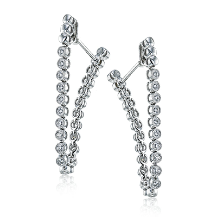 These versatile earrings can be worn in two ways, transforming from a line of diamonds into soft hoops. They're perfect for going from day to night.