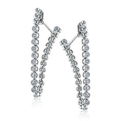 These versatile earrings can be worn in two ways, transforming from a line of diamonds into soft hoops. They're perfect for going from day to night.