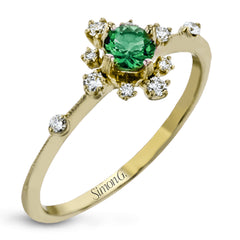 This charming 18k yellow gold ring is perfect for stacking and contains a .35 ct center tsavorite stone and .13 ctw accent diamonds.
