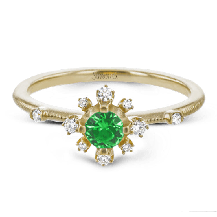 This charming 18k yellow gold ring is perfect for stacking and contains a .35 ct center tsavorite stone and .13 ctw accent diamonds.