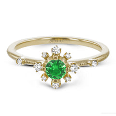 This charming 18k yellow gold ring is perfect for stacking and contains a .35 ct center tsavorite stone and .13 ctw accent diamonds.