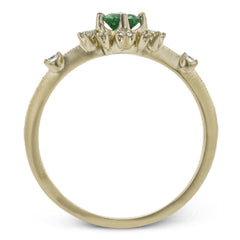 This charming 18k yellow gold ring is perfect for stacking and contains a .35 ct center tsavorite stone and .13 ctw accent diamonds.