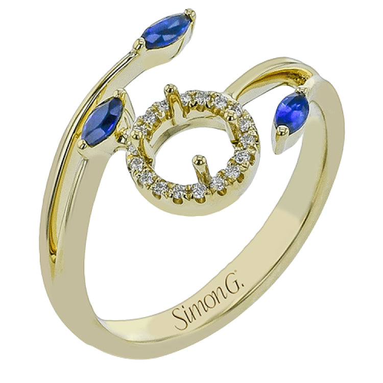 This delightful 18k white and yellow gold ring is set with one .25 ctw emerald and .06ctw of white diamonds and .16ctw marquise diamonds in its bypass design