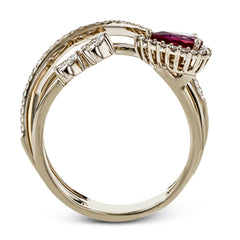 This dynamic 18k rose gold ring features a .45 ct ruby gemstone and .32 ctw of pear and round shape white diamonds.