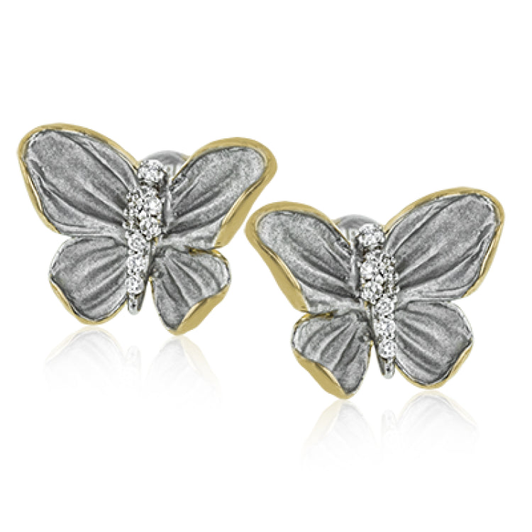 These butterfly stud earrings are set with .10 ctw of white diamonds and feature both gray and yellow gold.