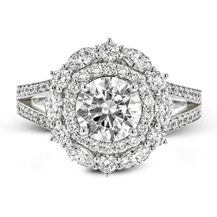 Rows of diamonds create a stunning effect in this 18k white gold engagement ring made for a round diamond. A total of .65 ctw of round diamonds and .35 ctw marquise diamonds surround the center stone.