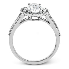 This delightful engagement ring features a scalloped halo that surrounds the center stone like a flower, containing .52 ctw of white diamonds.