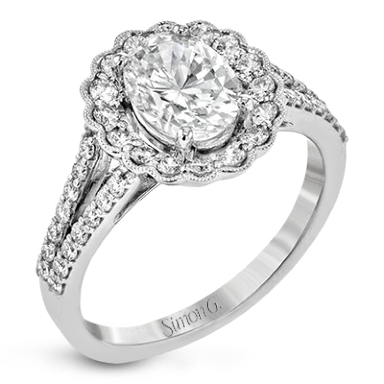 This delightful engagement ring features a scalloped halo that surrounds the center stone like a flower, containing .52 ctw of white diamonds.