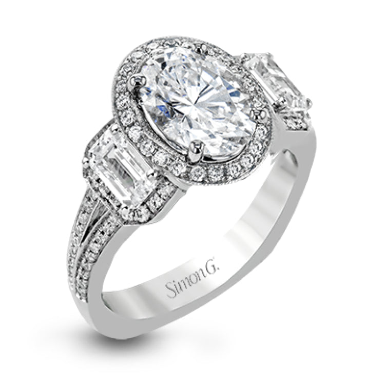 This impressive white gold ring features .43 ctw emerald cut side diamonds and is accented with .38 ctw round cut diamonds.