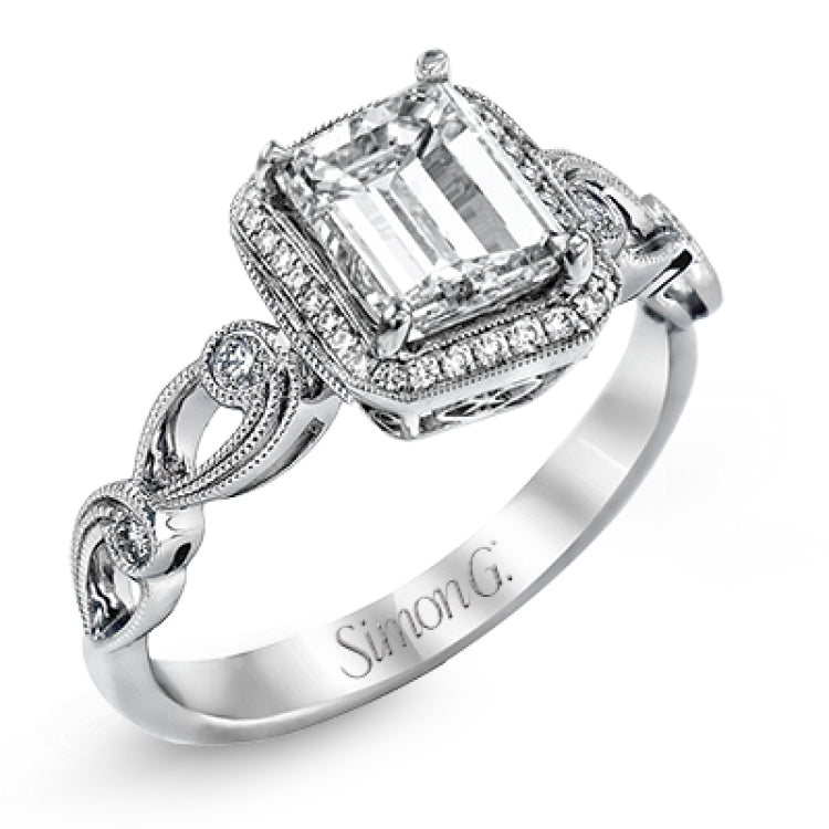 Reflecting a lovely romantic design, this white gold classic engagement ring features .16 ctw round cut white diamond accents.