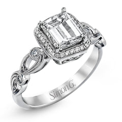 Reflecting a lovely romantic design, this white gold classic engagement ring features .16 ctw round cut white diamond accents.