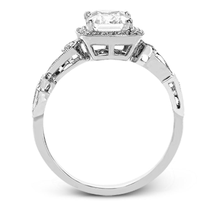 Reflecting a lovely romantic design, this white gold classic engagement ring features .16 ctw round cut white diamond accents.