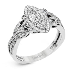 This amazing 18k white gold engagement ring features vintage-inspired design elements set with .28 ctw of white diamonds.