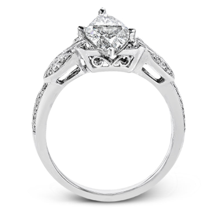 This amazing 18k white gold engagement ring features vintage-inspired design elements set with .28 ctw of white diamonds.
