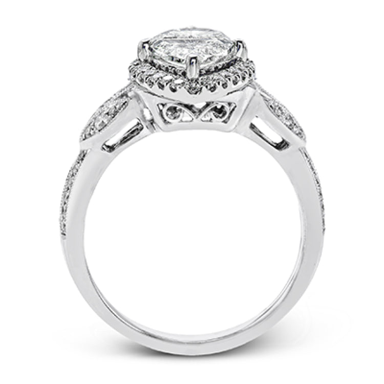 This amazing 18k white gold engagement ring features vintage-inspired design elements set with .28 ctw of white diamonds.