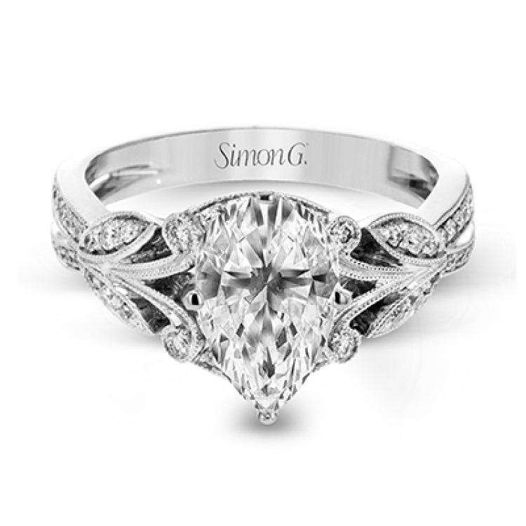 This amazing 18k white gold engagement ring features vintage-inspired design elements set with .28 ctw of white diamonds.
