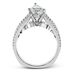 The lovely vintage style of this white gold engagement ring is further enhanced by .91 ctw of shimmering round cut diamonds.