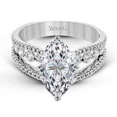 The lovely vintage style of this white gold engagement ring is further enhanced by .91 ctw of shimmering round cut diamonds.