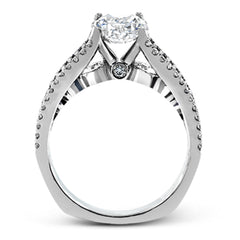 The lovely vintage style of this white gold engagement ring is further enhanced by .91 ctw of shimmering round cut diamonds.